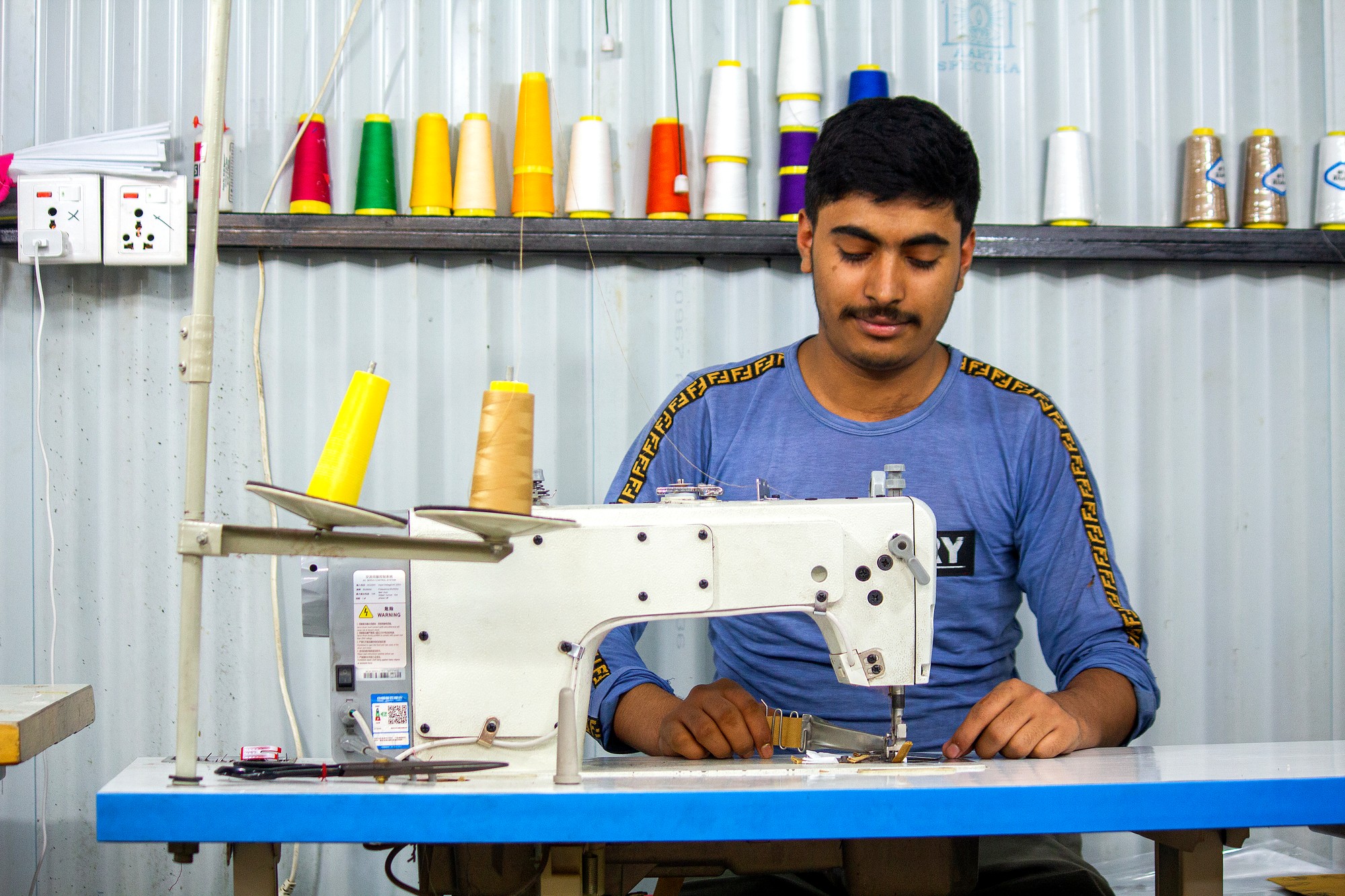 Master Artisan at Industrial Sewing Machine - Eco Print & Pack Nepal