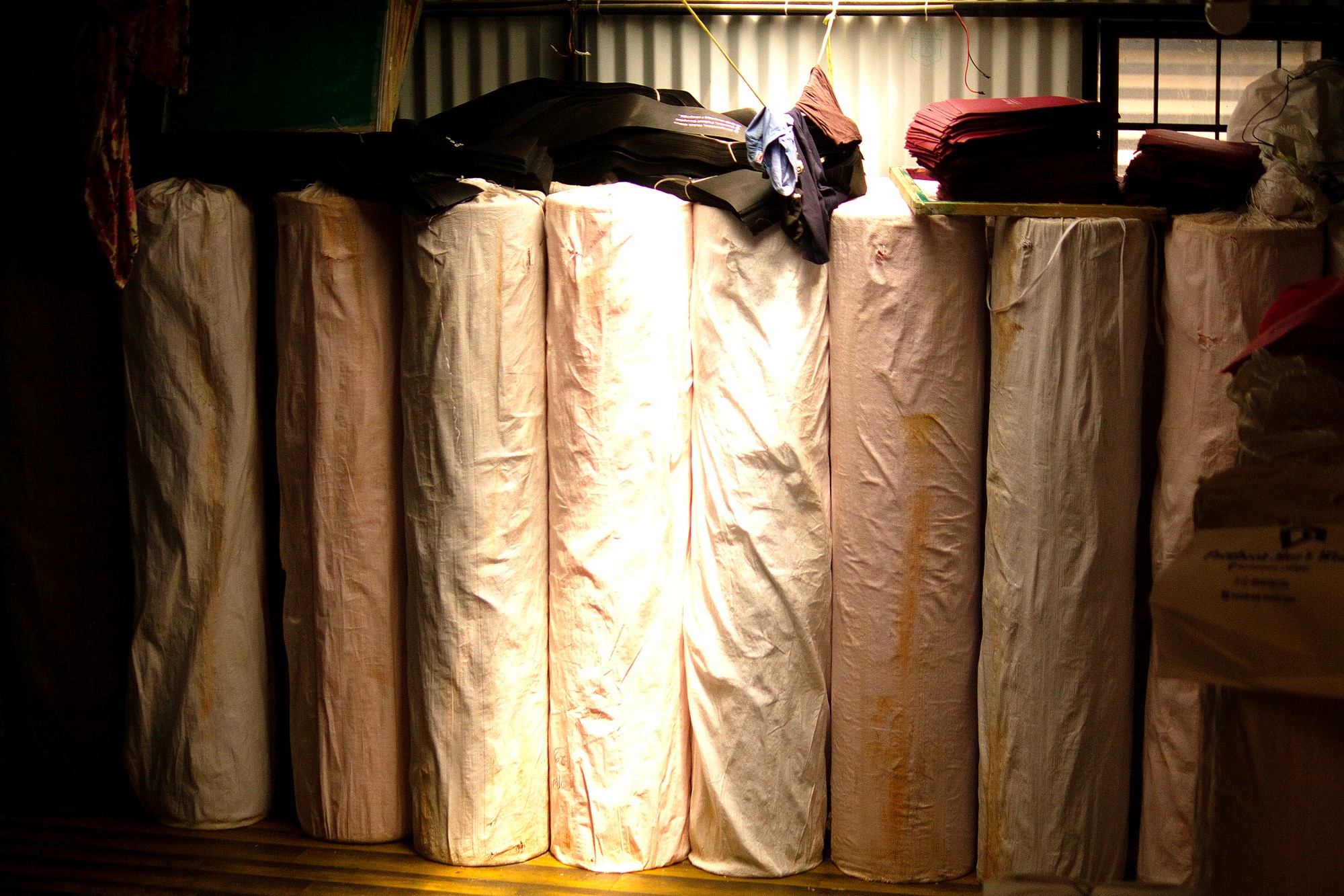 Raw Non-Woven Fabric Rolls in Material Storage - Eco Promotional Industries
